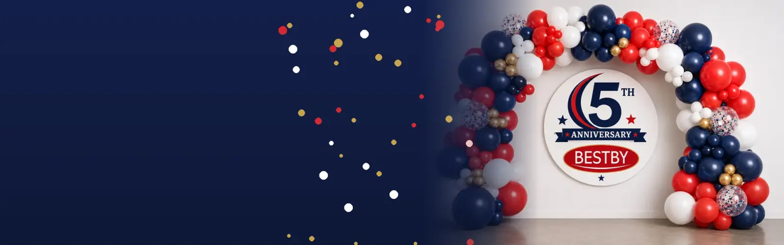 Navy, red, white and gold balloon arch around a Bestby 5th anniversary sign